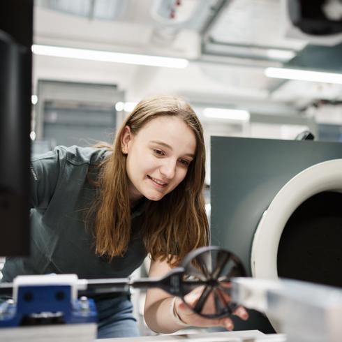 A woman calibrates a flow velocity measuring device